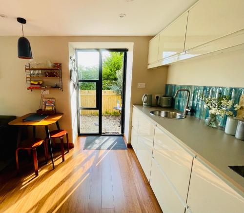 a kitchen with a sink and a counter top at The Hideaway Apartment, Bath in Bath
