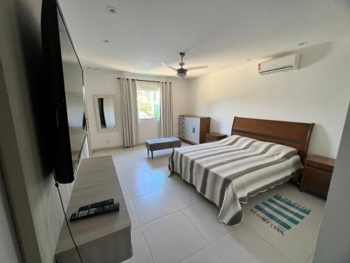 Ένα ή περισσότερα κρεβάτια σε δωμάτιο στο Casa de Praia em Búzios