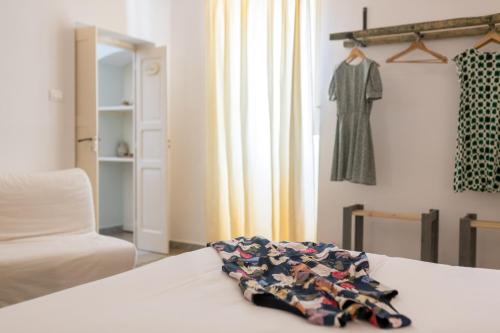 a bedroom with a bed with a quilt on it at La Casèdde in Cisternino