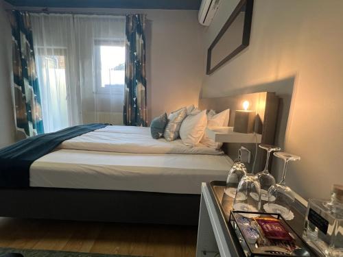 a bedroom with a large bed with a window at Margaréta Garden & SPA in Eger