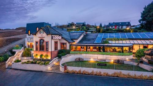 a house with solar panels on top of it at Flagstaff Lodge in Newry