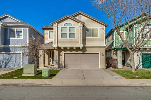 a house with a garage on a street at 5 Mi to Downtown Reno Home with Lake Access! in Sparks