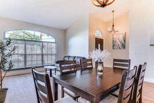 a dining room and living room with a table and chairs at Valrico Home with Yard about 14 Mi to Downtown Tampa in Valrico