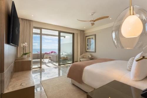 Ένα ή περισσότερα κρεβάτια σε δωμάτιο στο Grand Velas Boutique Hotel