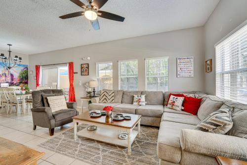 a living room with a couch and a table at 8 Mi to Disney Villa with Screened Pool and Lanai in Kissimmee