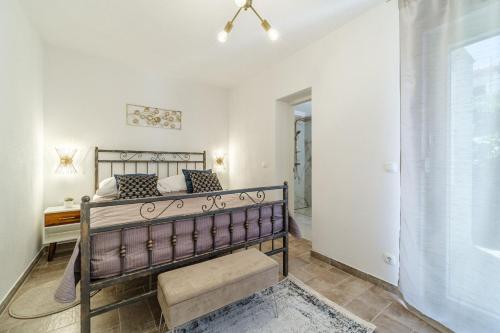 a bedroom with a bed in a room with a window at House Josipa in Supetar