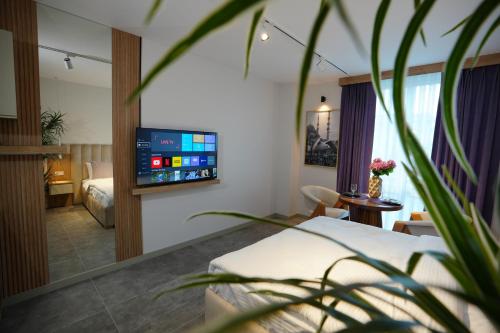 a hotel room with a bed and a tv at Dream house 22 in Istanbul