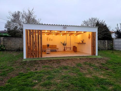 a large white room with a couch in a yard at Casa Maruxa in A Coruña