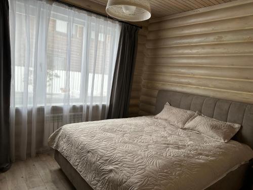 Ένα ή περισσότερα κρεβάτια σε δωμάτιο στο Бозайгыр