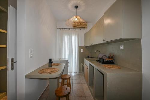 a kitchen with two sinks and a counter top at Fabio Studios in Kionia
