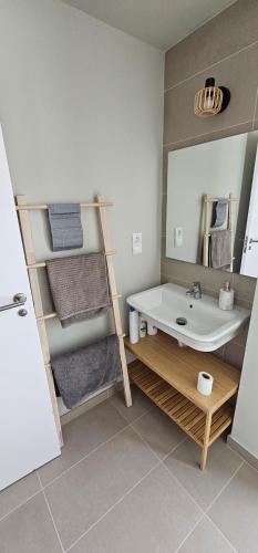 a bathroom with a sink and a mirror at Abades Beach in Abades