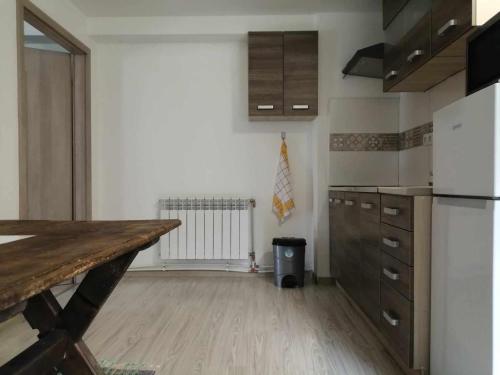 a kitchen with a counter top and a refrigerator at Oddychový pobyt na rodinnej farme in Matiaška