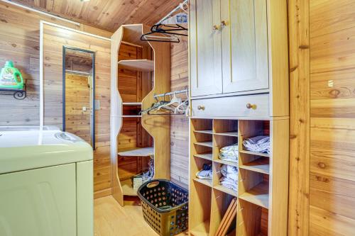 a log cabin bathroom with a wine cellar at Delton Lake House with Boat Dock Fish, Swim and More! in Orangeville