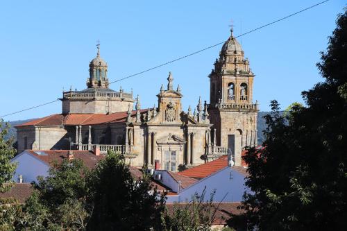 an old building with two towers on top of roofs at “Casa abella “ in La Magdalena