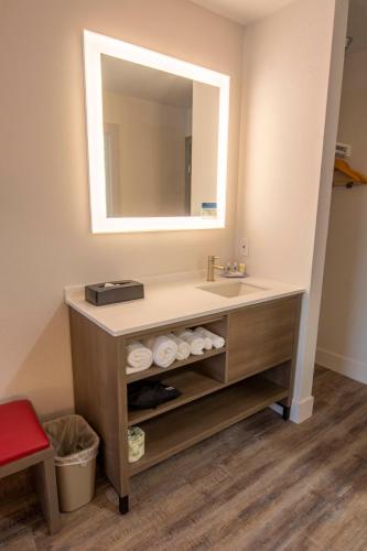 a bathroom with a sink and a mirror at Comfort Inn Battle Mountain - Midway Between Elko and Winnemucca in Battle Mountain