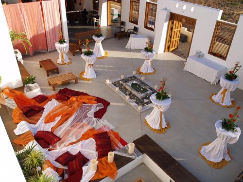 an aerial view of a patio with tables and flowers at Hotel Los Patios - Parque Natural in Rodalquilar