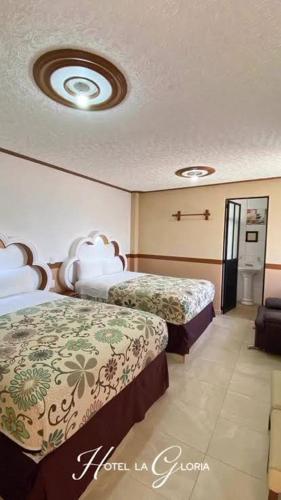 Katil atau katil-katil dalam bilik di Hotel La Gloria Express