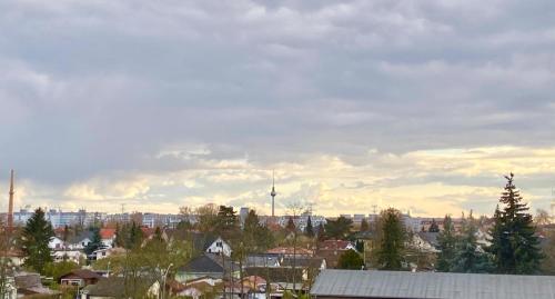 a view of a city with buildings and trees at GASTEM UG in Berlin