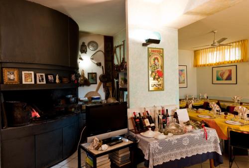 a kitchen with a table and a dining room at Hotel Letizia in Orte