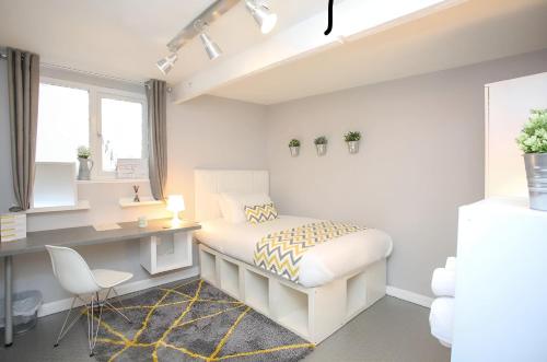 a white bedroom with a desk and a bed at New Modern Room With En Suite Park Street Room 2 in Luton