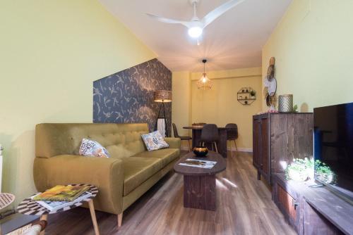 a living room with a couch and a table at Albada Huesca in Huesca