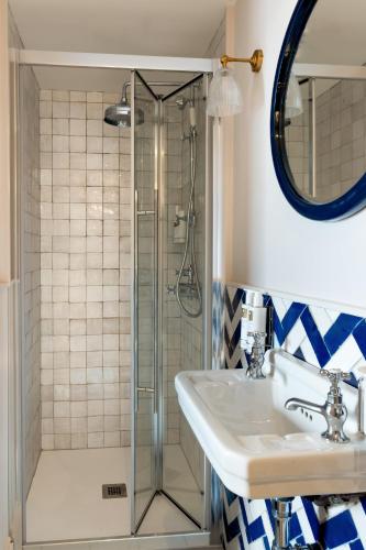 a bathroom with a sink and a shower at The Penn in Windermere