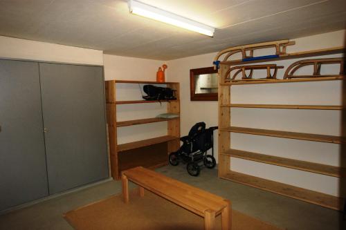 a room with a bunk bed and a bench in it at Cadras in Tinzen