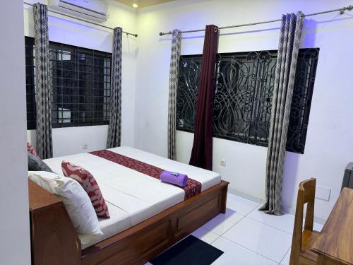 Una cama o camas en una habitación de ilé-ifè GUESTHOUSE OUIDAH