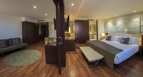 Ein Bett oder Betten in einem Zimmer der Unterkunft Hotel Gran Ultonia