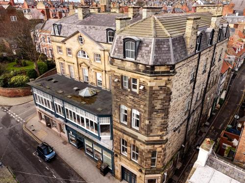 an overhead view of an old building on a city street at The Resolution Hotel in Whitby