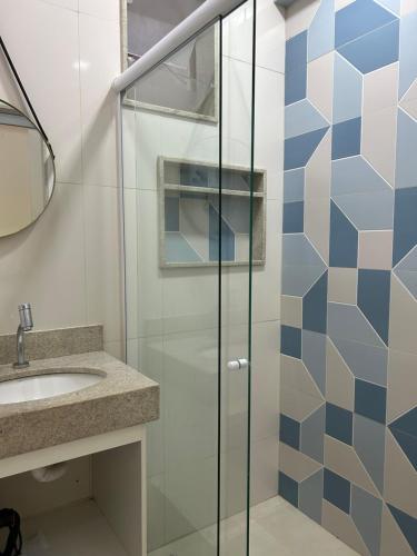 a bathroom with a shower and a sink at COPACABANA RIO PRAIA 18 in Rio de Janeiro