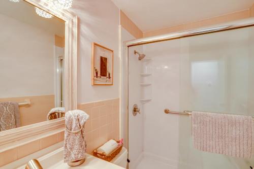 a bathroom with a shower with a glass door at Saratoga Springs Haven with Pool and Fire Pit! in Saratoga Springs