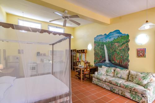 a living room with a bed and a couch at Cabier Ocean Lodge in Crochu