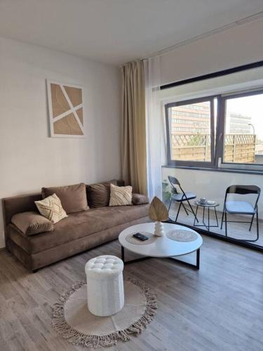 a living room with a couch and a table at Apartmán v meste Bratislava in Bratislava