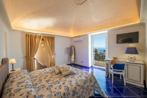a hotel room with a bed and a balcony at Le Contrade by Sosòre Holiday Homes -Amalfi Coast in Furore