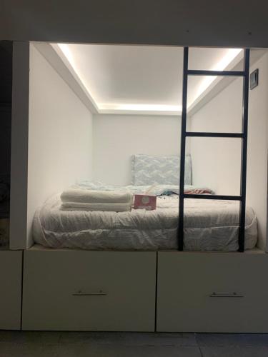 a bed in a room with a mirror at Ramble Stay Hostel Burj Khalifa view in Dubai