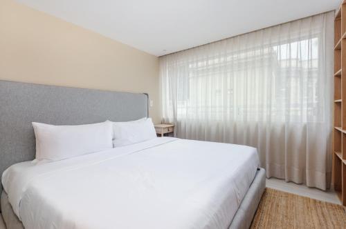 Cama ou camas em um quarto em Querétaro 168 by Wynwood House