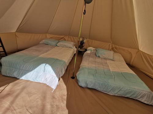 Postel nebo postele na pokoji v ubytování #Y4 Aurora Haven Yurt