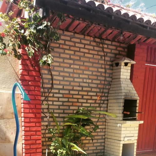 a brick building with a pizza oven on it at Casa Boa Venttura Guajiru 3 quartos com ar e piscina in Trairi