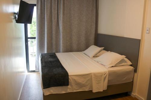 Säng eller sängar i ett rum på Hotel do Vale