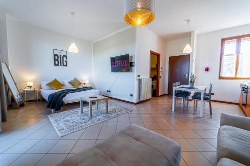 Postel nebo postele na pokoji v ubytování LIttleSuite Fiera5 min