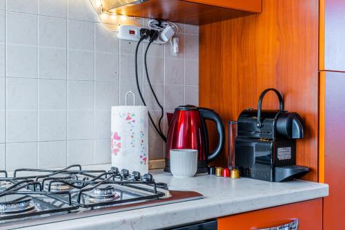 Kuchyň nebo kuchyňský kout v ubytování LIttleSuite Fiera5 min