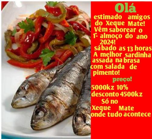 three sardines on a plate with a salad at Hospedaria Restaurante Xeque Mate in Luanda