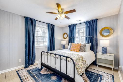 a bedroom with a bed and a ceiling fan at Water View Retreat in Kingsland
