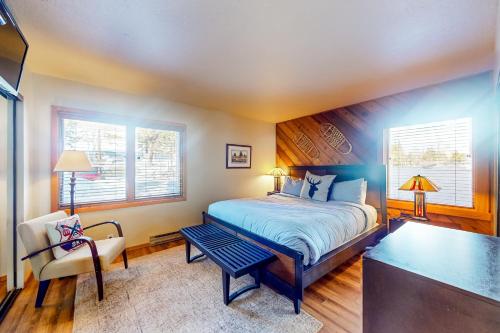 a bedroom with a bed and a desk and a chair at Snowcreek 443 in Mammoth Lakes