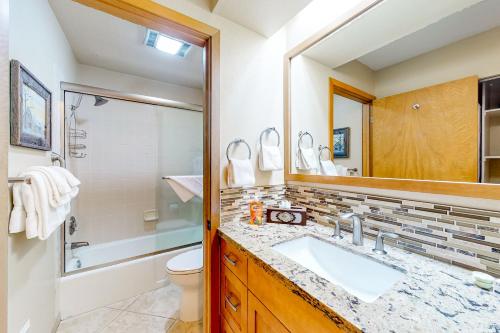 a bathroom with a sink and a shower and a toilet at Snowcreek 443 in Mammoth Lakes