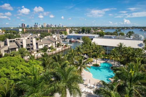 an aerial view of a resort with a pool and palm trees at Hilton Fort Lauderdale Marina in Fort Lauderdale