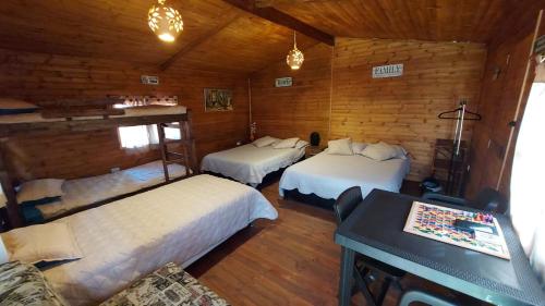 Postel nebo postele na pokoji v ubytování Mundo Nuevo Cabañas