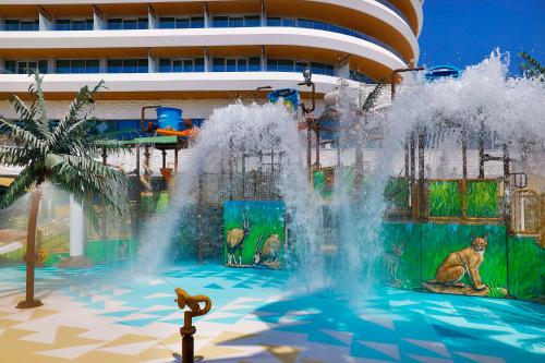a fountain in the middle of a water park at Waldorf Astoria Doha Lusail in Doha
