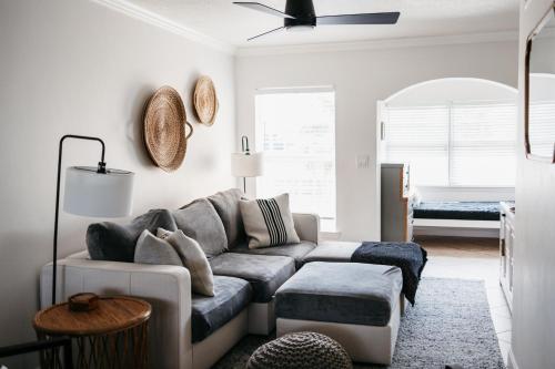 a living room with a couch and a table at IT'S A SHORE THING - stay, relax, & enjoy! in Clearwater Beach